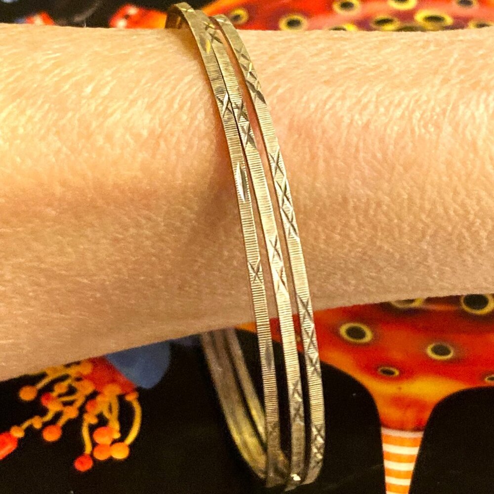 Trio of shimmering bangles in sterling silver